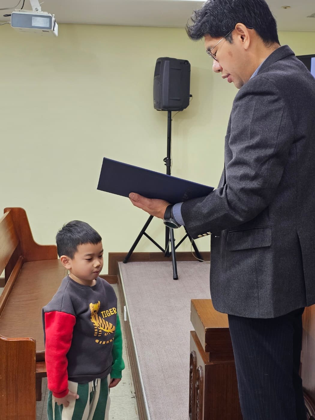 Pastor with child